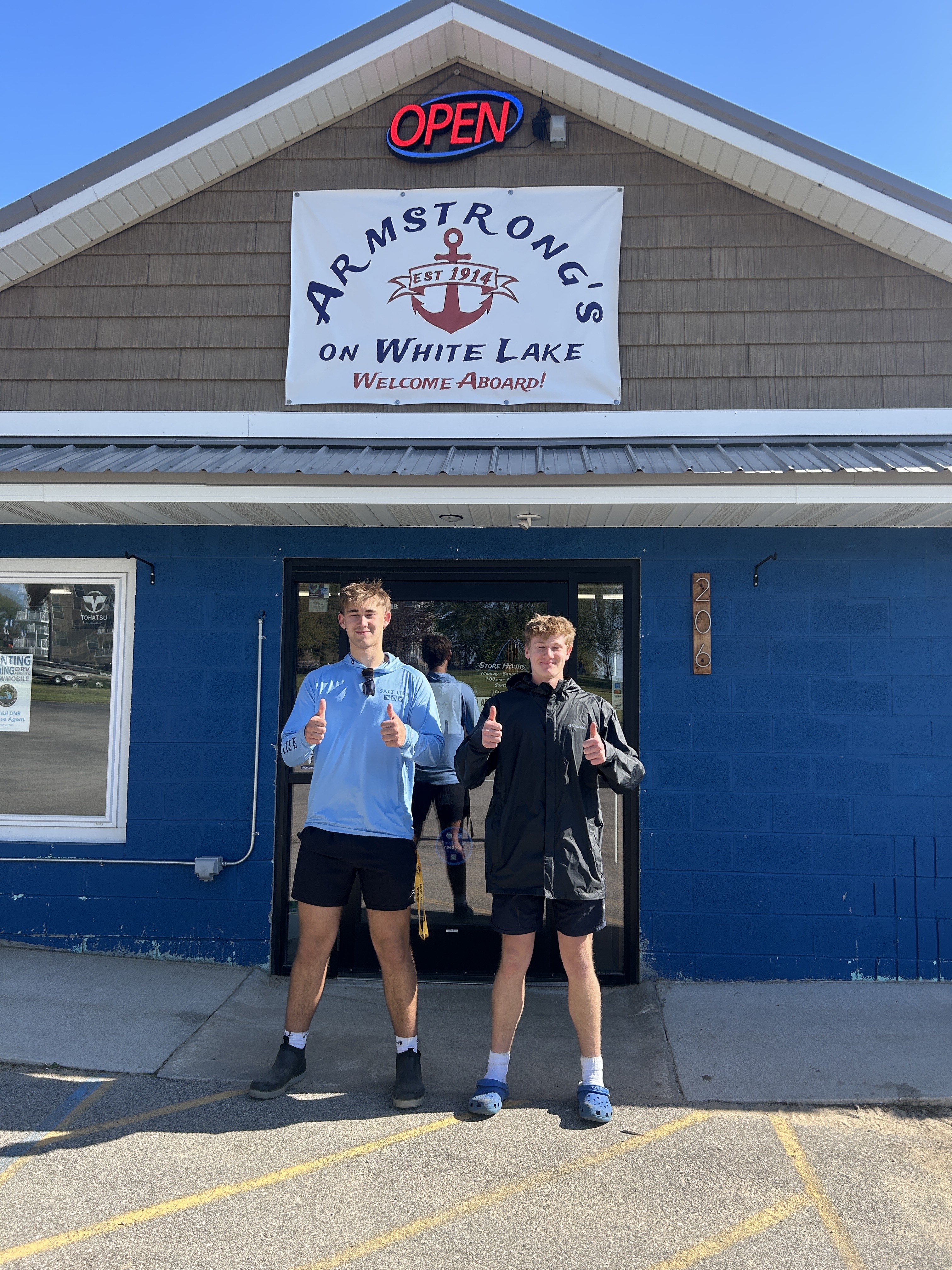 Six metal molds with a fish design lined up neatly on a bench, showcasing a range of fish shapes; the most prominent fish-...